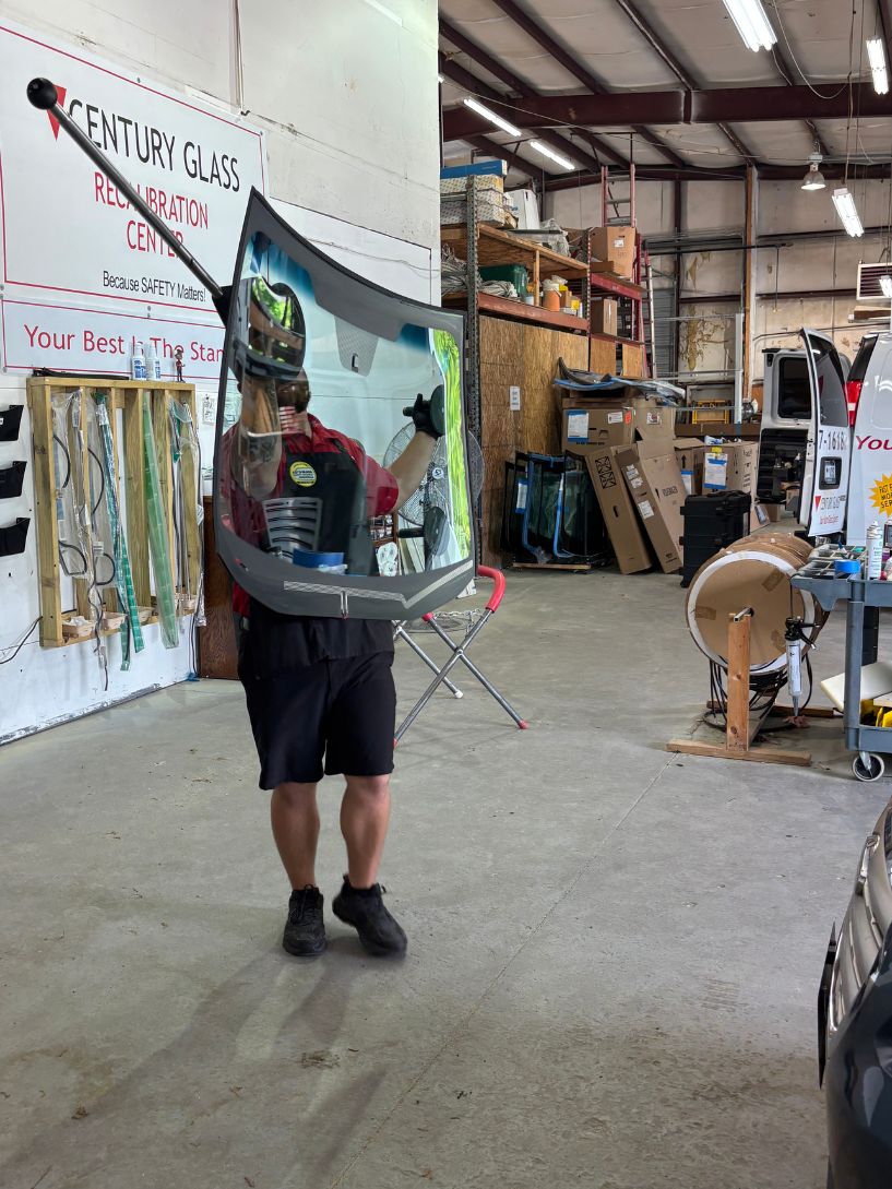 Bus sized RV getting the windshield repaired by the Century Glass team.