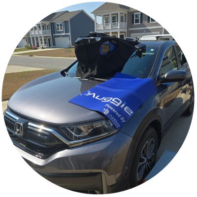 Mobile Advanced Driver Assistance Systems (ADAS) on a new windshield on a silver Honda.