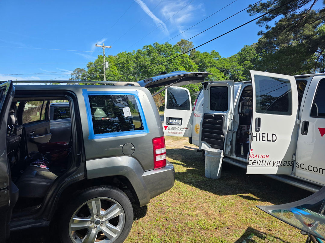 car-door-side-window-repair-on-site-mobile-services-south-carolina-sc Back window on truck broken and covered.