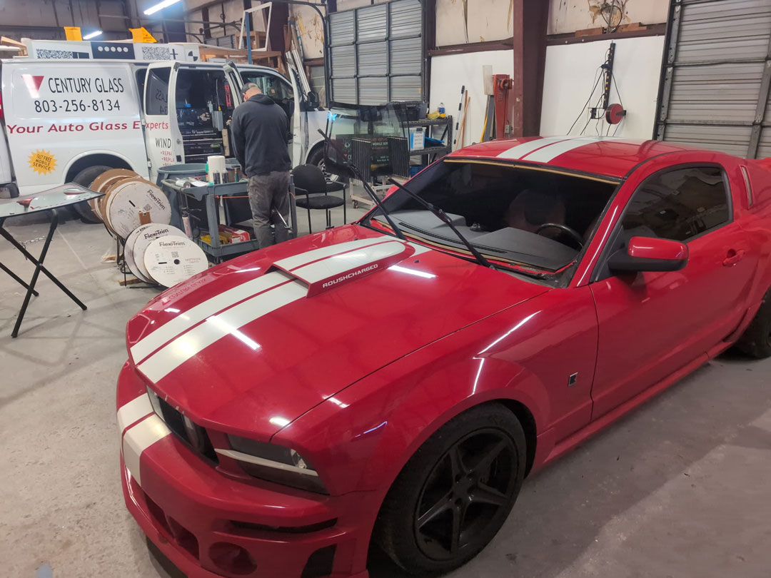 mustang-windshield-repalcement-service-near-me-south-carolina Windshield on stand in front of Dodge ram